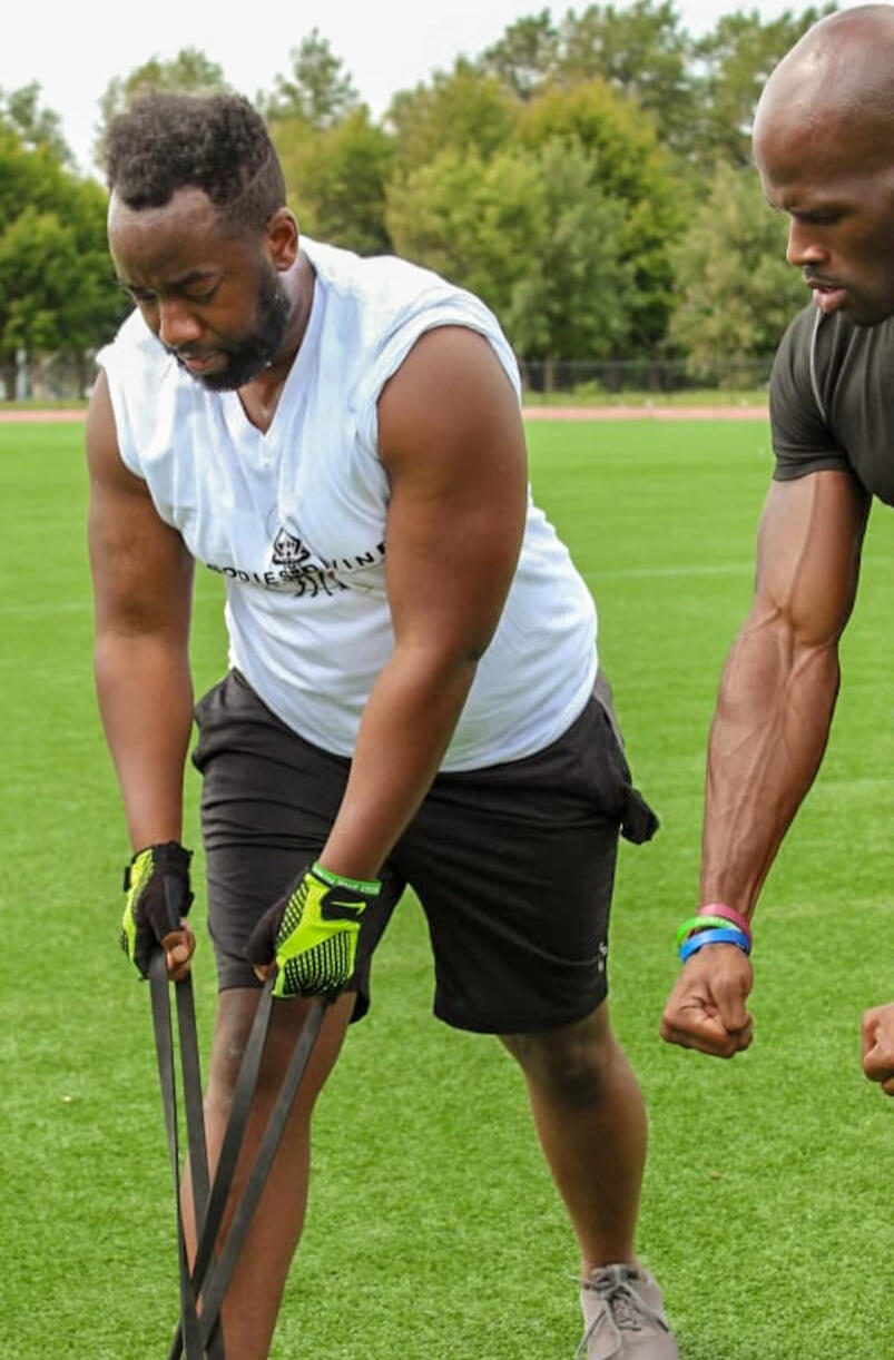 Photo of a guy doing a bicep curl with a dumbbell.