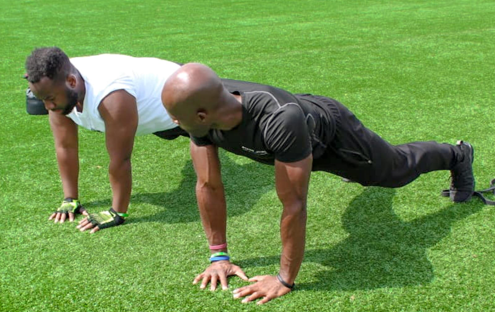 Photo of a guy doing a bicep curl with a dumbbell.