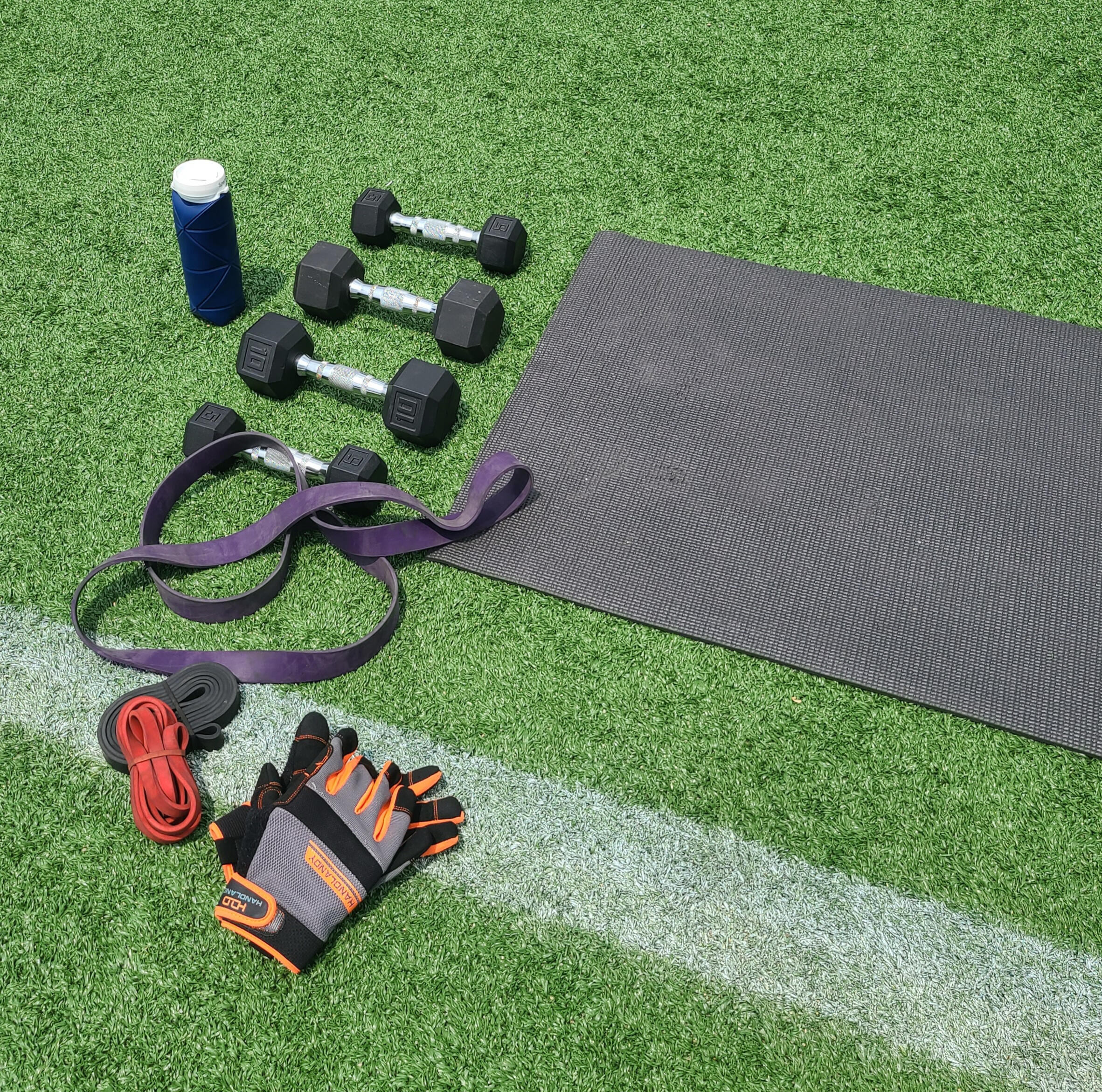 Photo of a guy doing a bicep curl with a dumbbell.