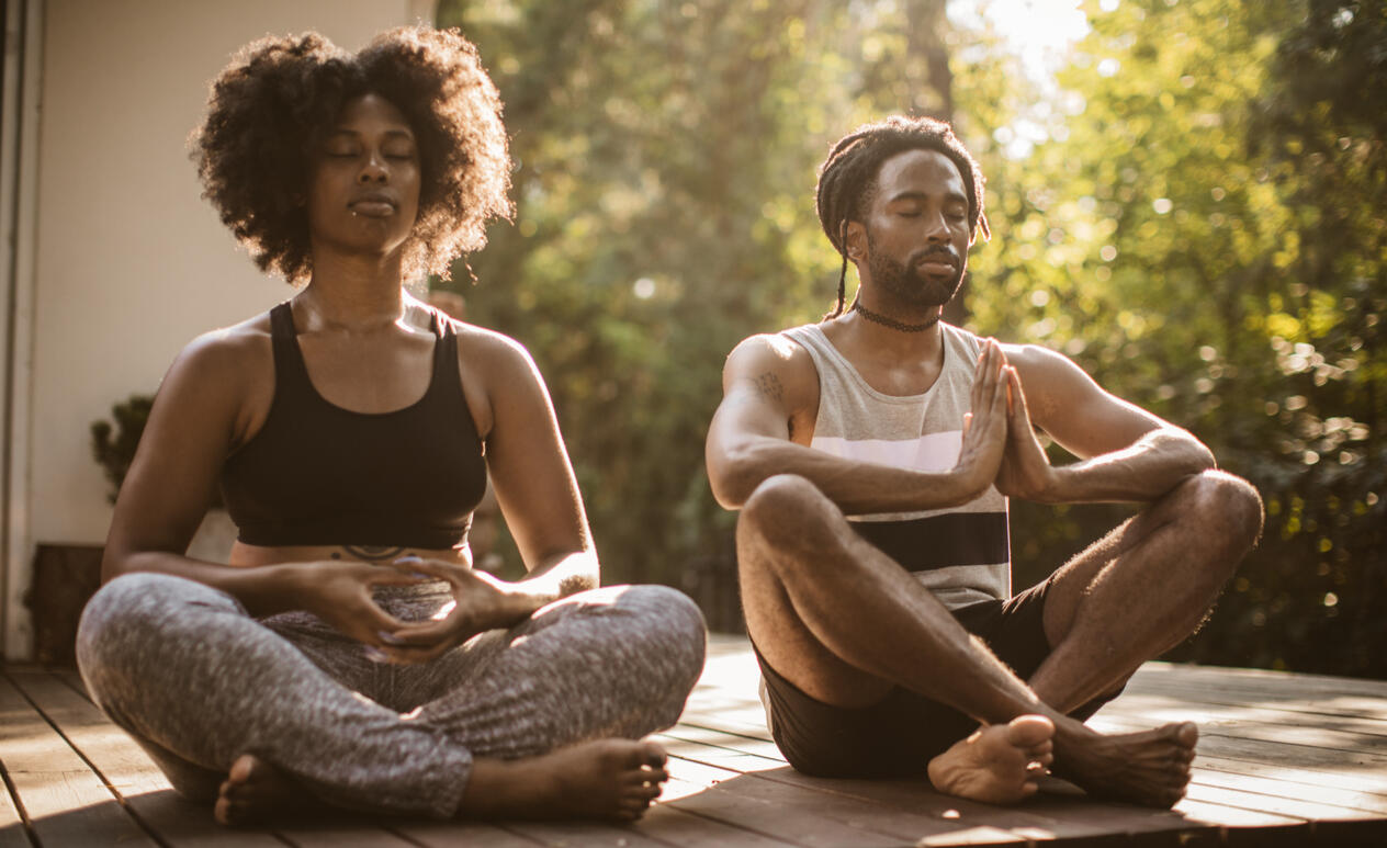 Photo of a guy doing a bicep curl with a dumbbell.